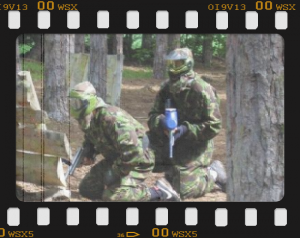 two players in action ready for paintball action